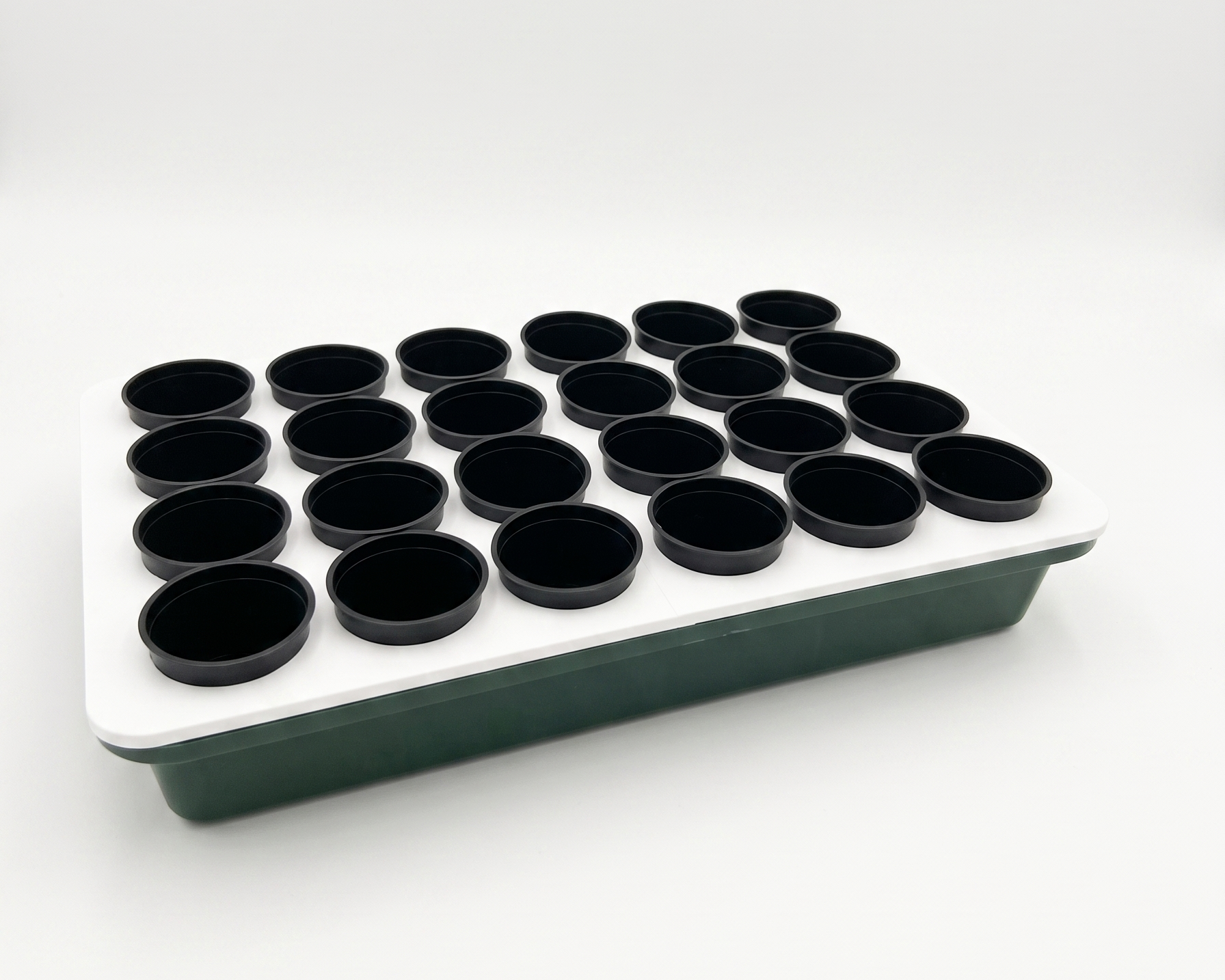 GrowTower Anzuchtbox mit weißer Deckelplatte und dunkelgrüner Unterschale, 24 wiederverwendbare schwarze Anzuchttöpfe